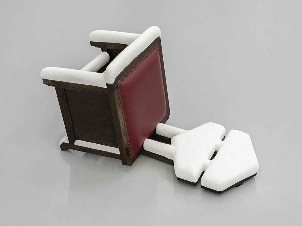 Overturned Frank Lloyd Wright and Arata Endo chair after a couple of inches of snowfall